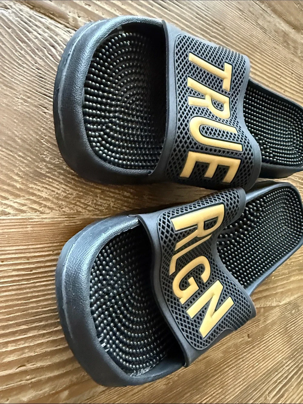 True Religion Black Slides with Gold Lettering